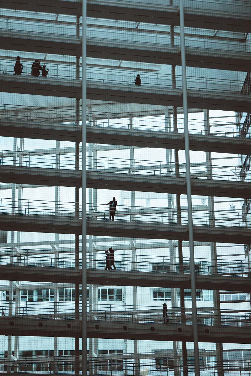 netherlands low-angle photography of people on building building